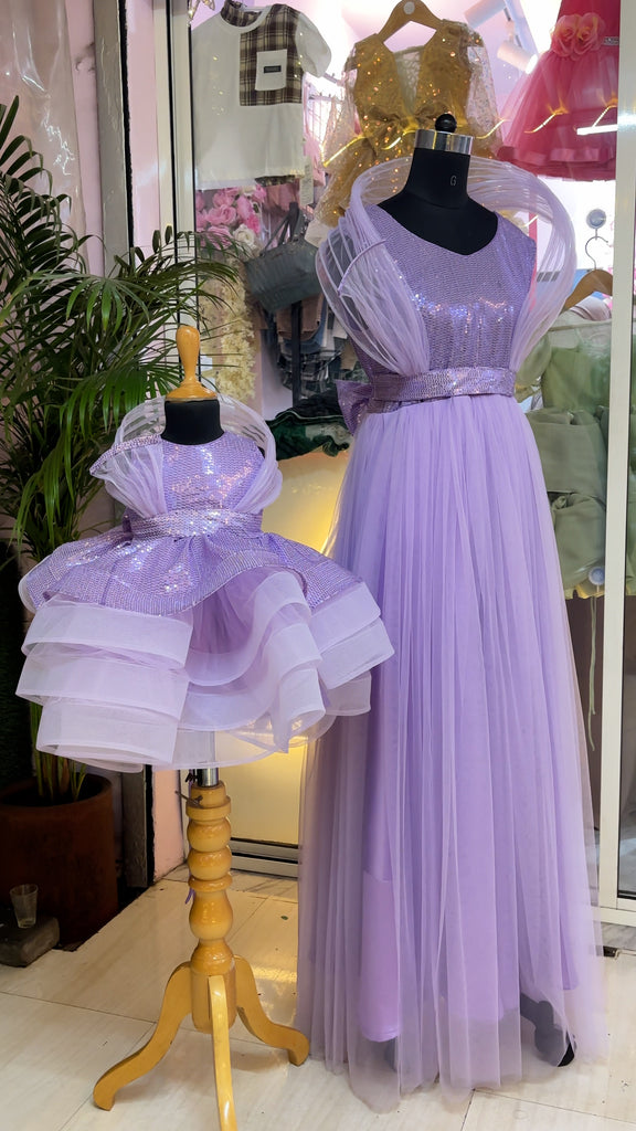 Two lavender dresses on mannequins with a blurred store interior background-by fashion dsigner in pune