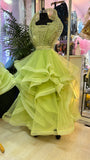 Light green evening gown on a mannequin in a store setting by fashion designer in pune
