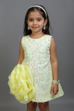 Young girl in a light dress holding a yellow flower against a gray background by fashion designers in pune