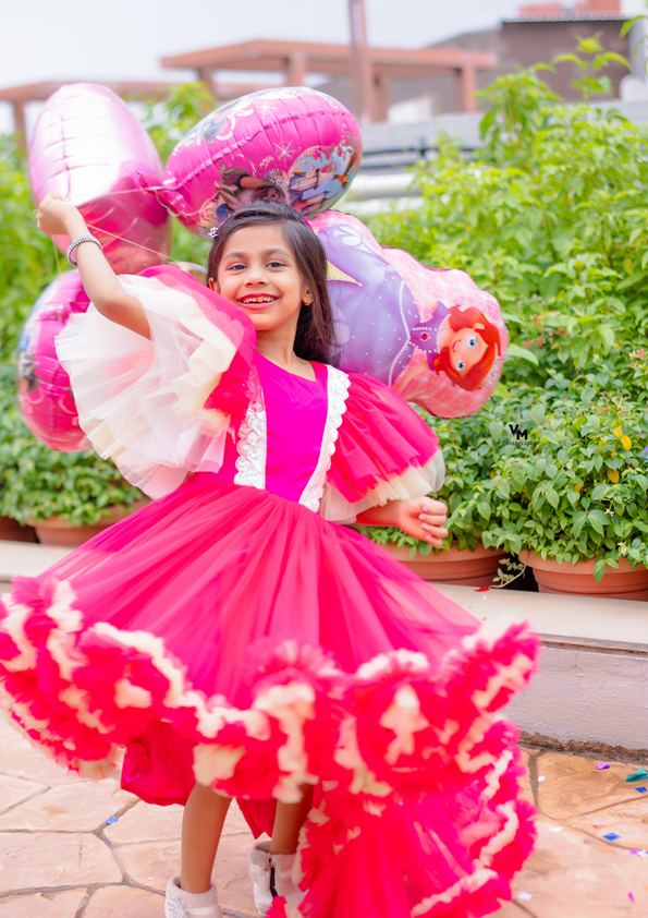 Child in a pink dress with fairy wings - Fashion Designer in pune