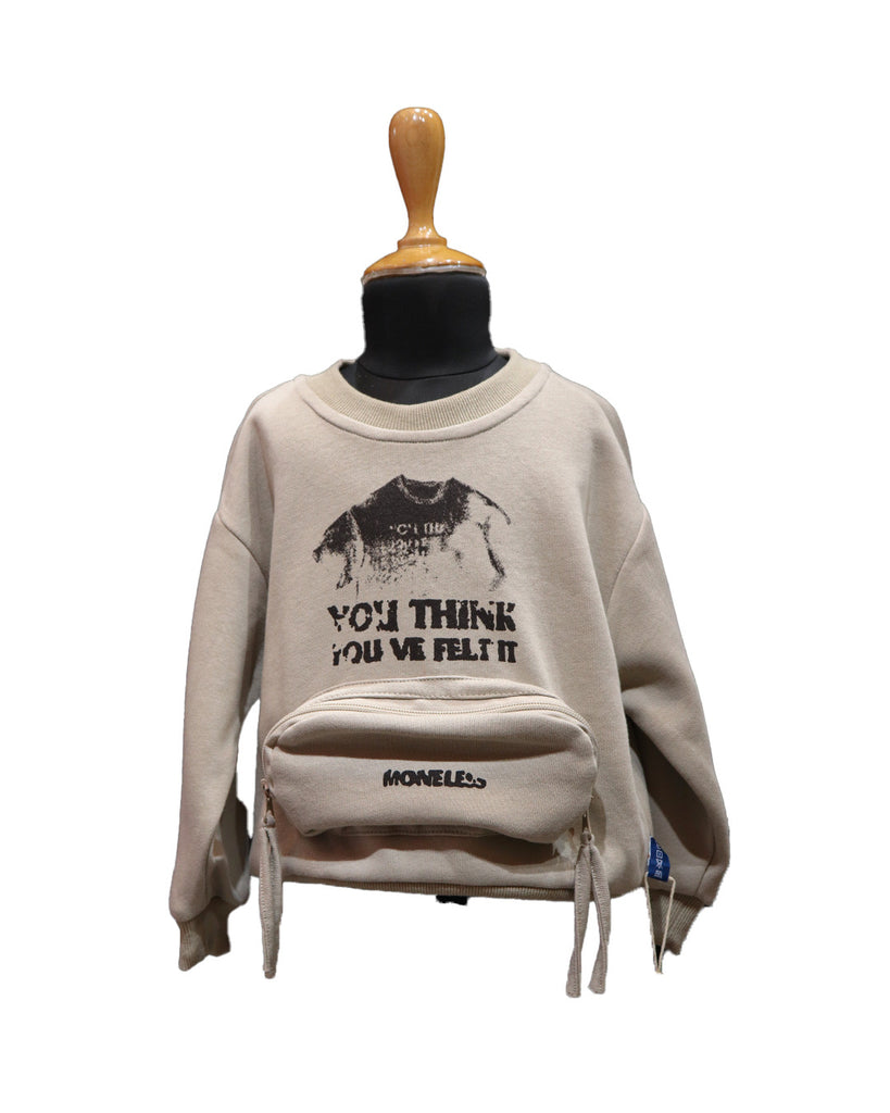 Beige sweatshirt with graphic design and text on a mannequin against a white background by best fashion designers in Pune