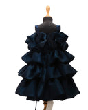 Navy blue ruffled dress on a mannequin against a white background by fashion designers in pune