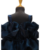 Navy blue dress on a mannequin with a white background by fashion designer in pune