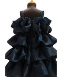 Black ruffled dress on a mannequin with a white background by fashion designers in pune