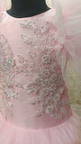 Pink dress with intricate silver embroidery on a mannequin against a blurred background by best fashion designers in pune