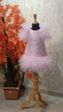 Pink dress on a mannequin with a decorative background by fashion designers in pune